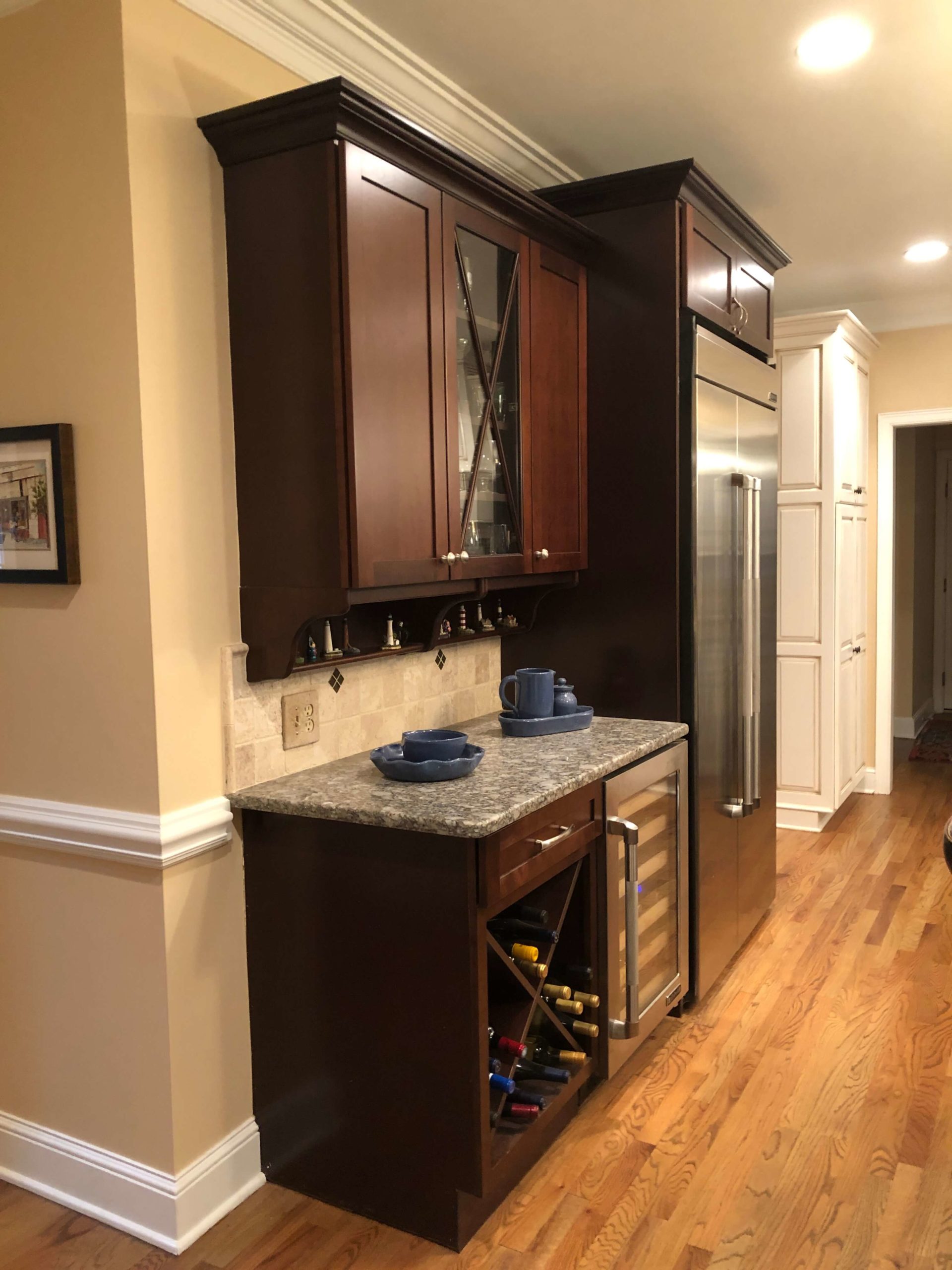 yellow beige floors, cherry cabinetry, and a pink beige backsplash Lindsey Putzier Design Studio 