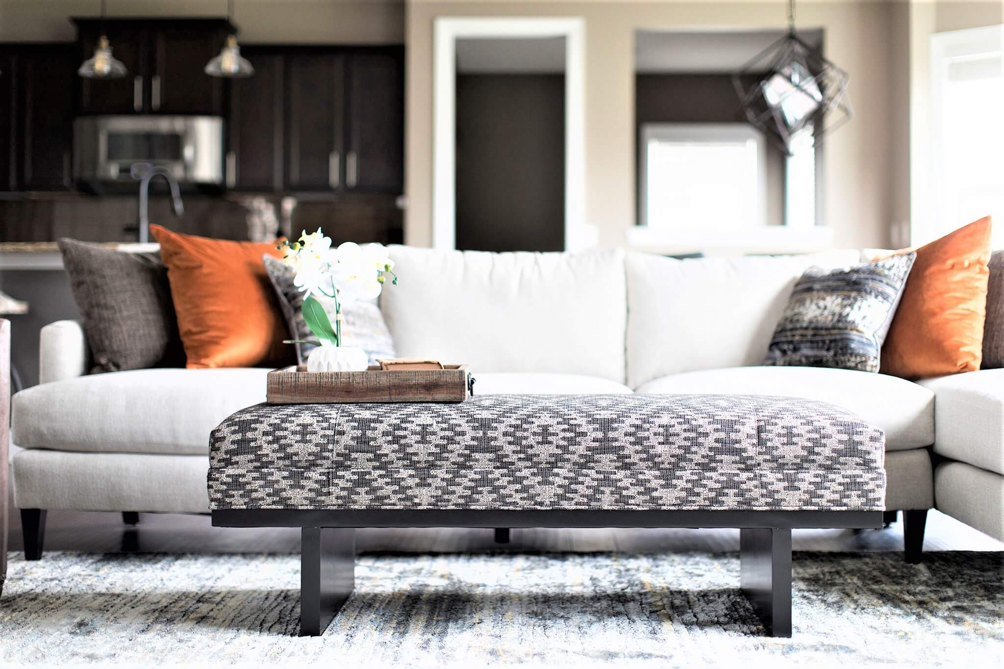 This ottoman doubles as a coffee table. Just add a tray for drinks! Lindsey Putzier Design Studio