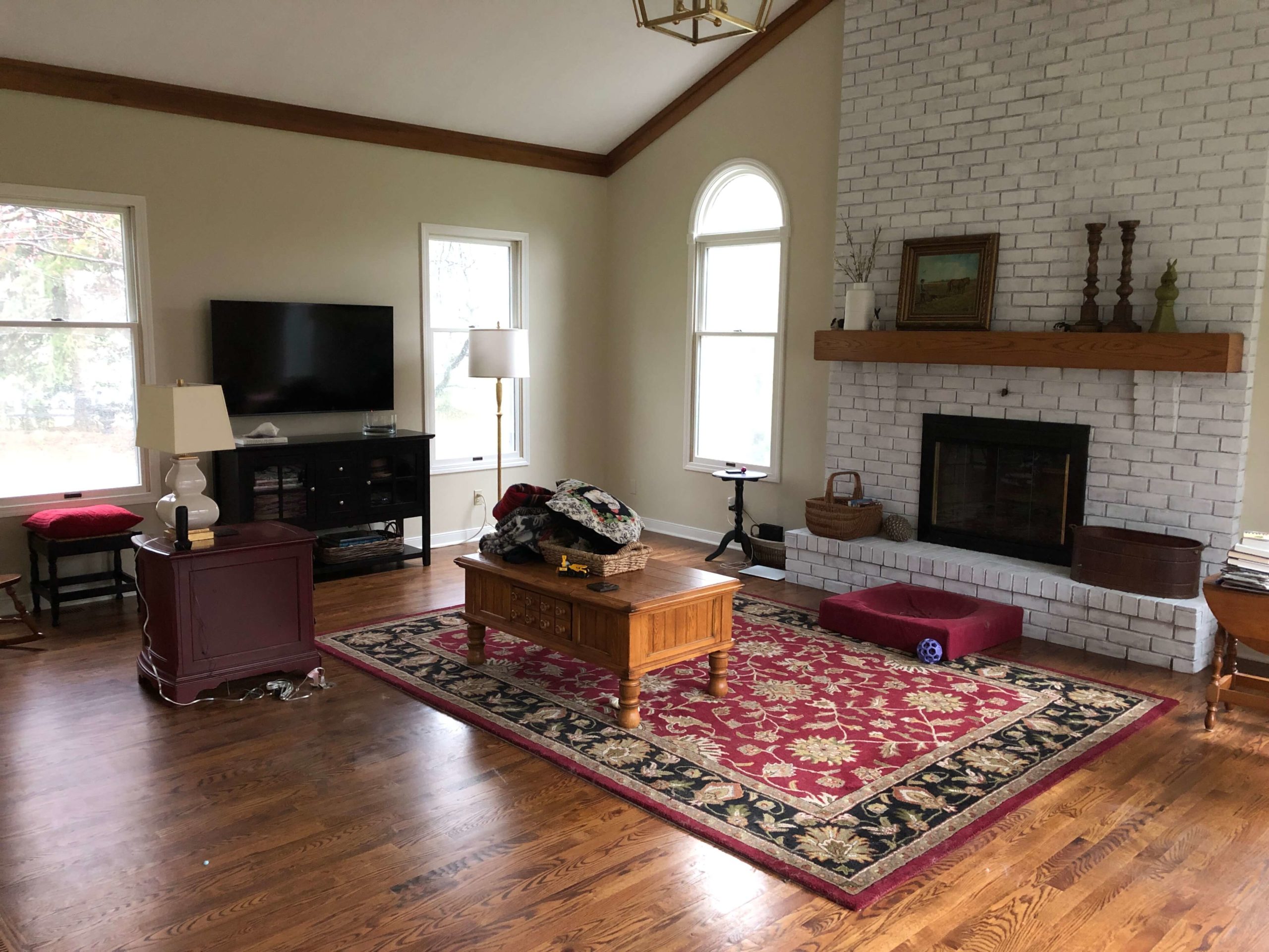 Red and Black Before Rug in Family Room Space Lindsey Putzier Design Studio Hudson, OH