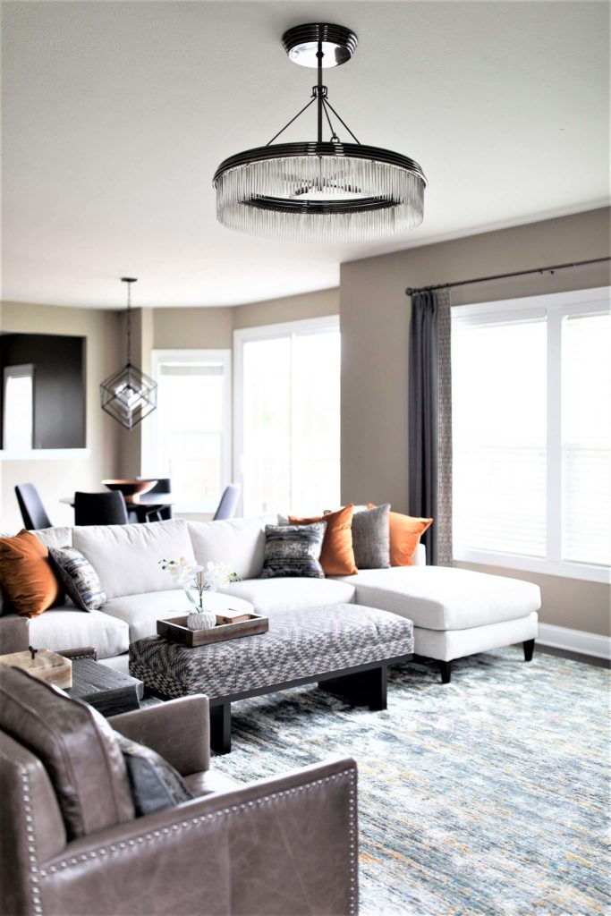 charcoal color with yellow beige granite counters, green beige walls, and cherry floors. Lindsey Putzier Design Studio