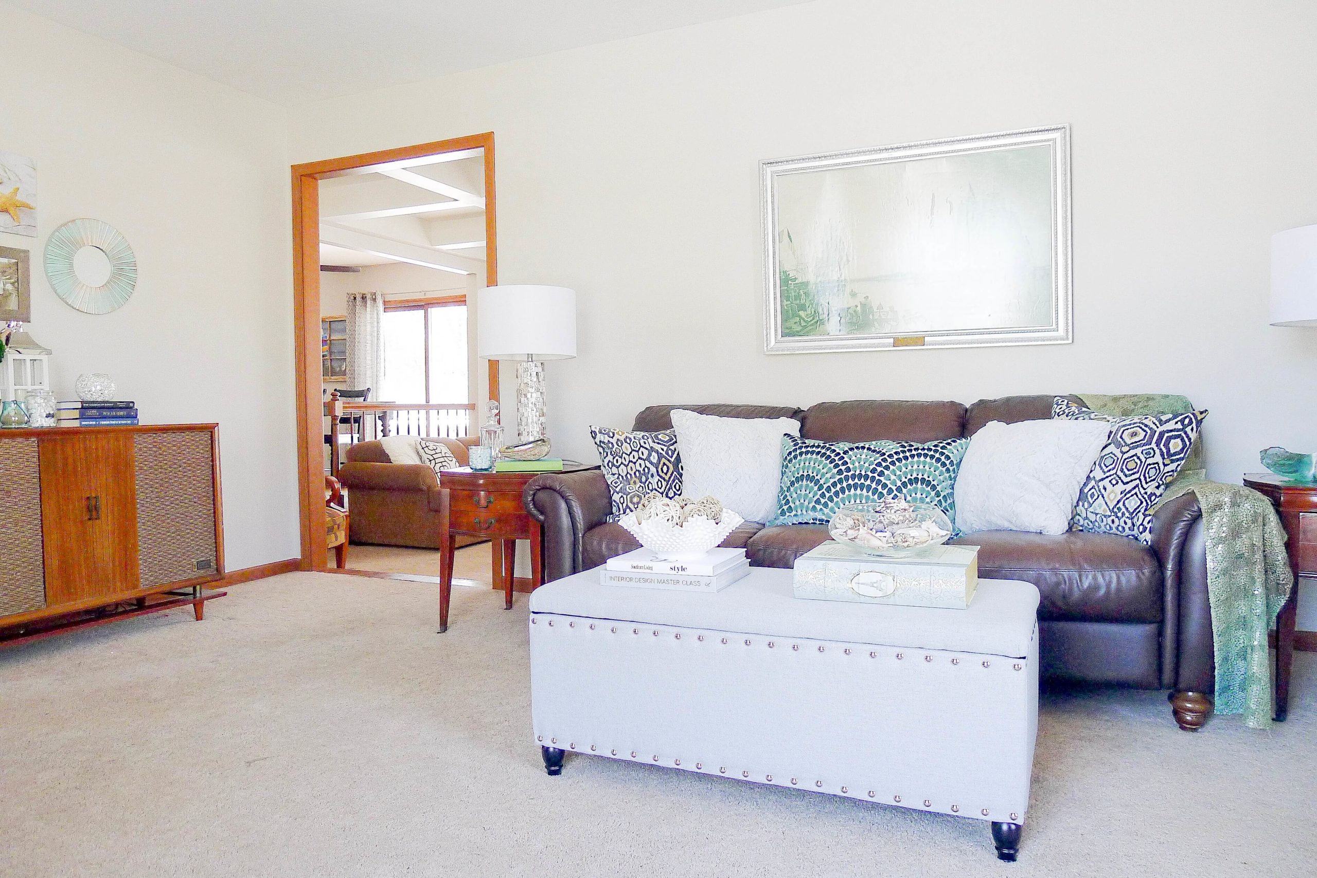 Home with Orange Oak Trim making walls look gray instead of taupe Lindsey Putzier Design Studio 