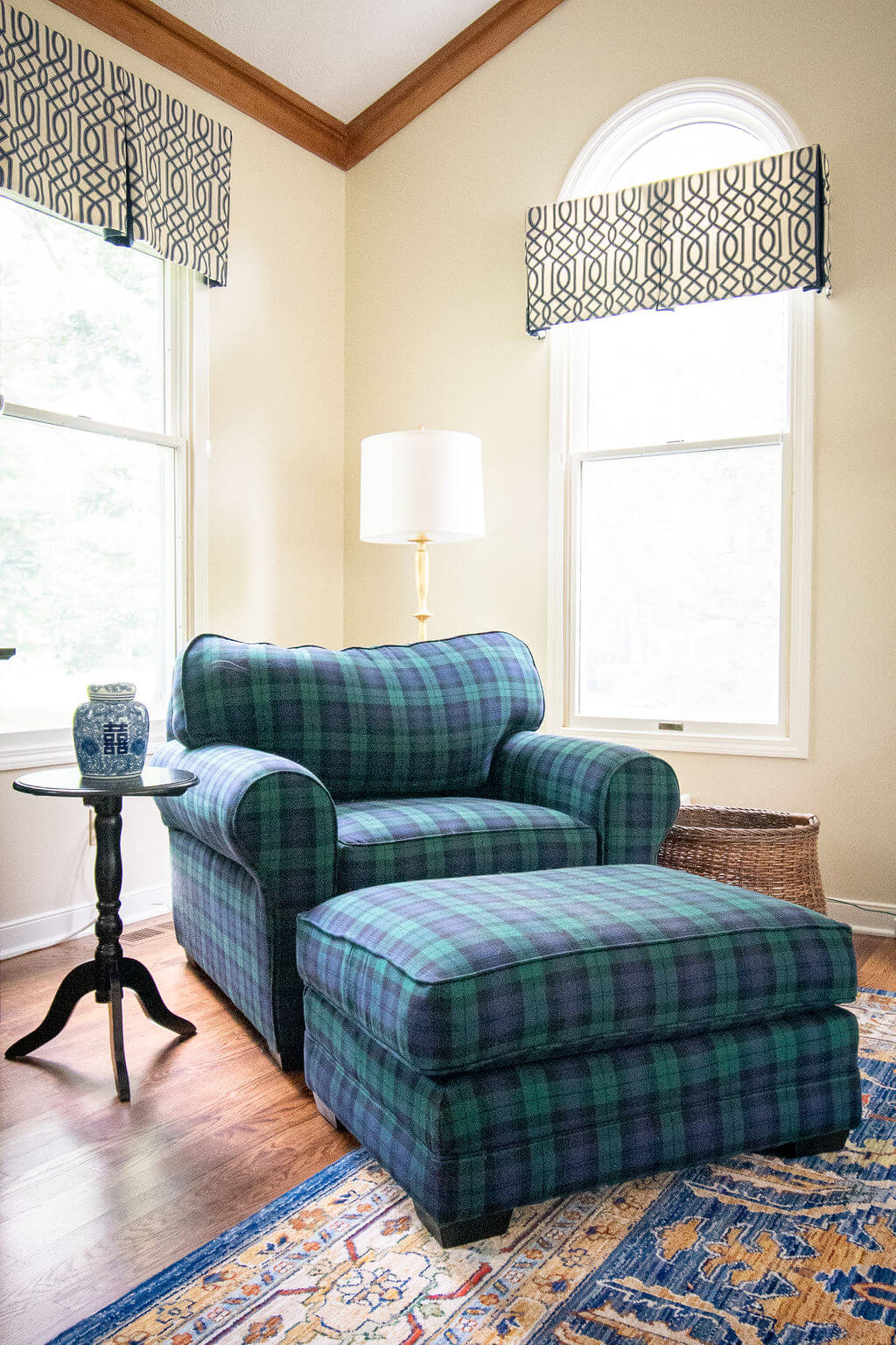 blue and green plaid chair and ottoman in After of Family Room Space Lindsey Putzier Design Studio