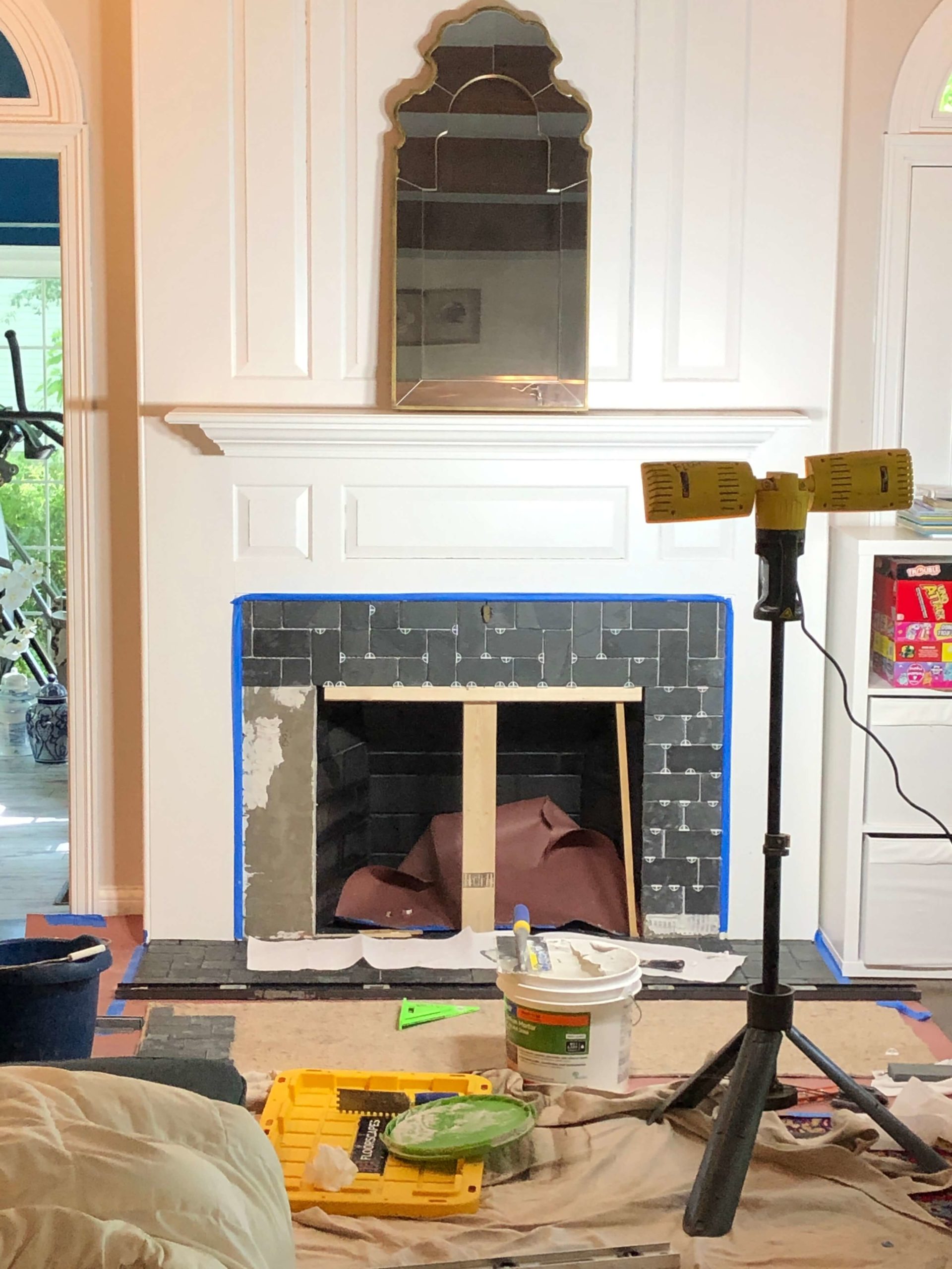 progress shot of the vertical surface of fireplace Lindsey Putzier Design Studio