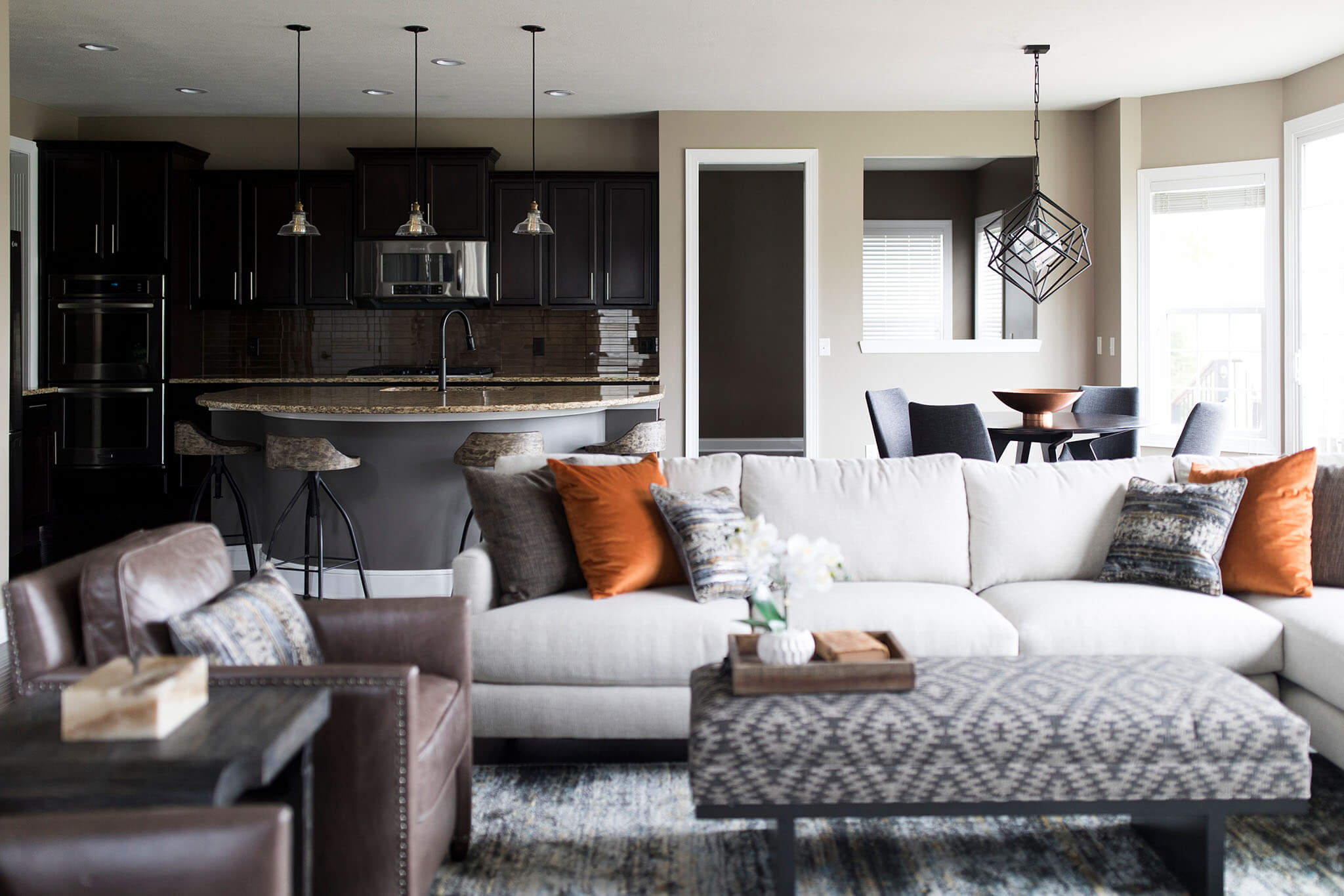 Moody Urban Home Family Room, Dinette, and Kitchen Space After Lindsey Putzier Design Studio