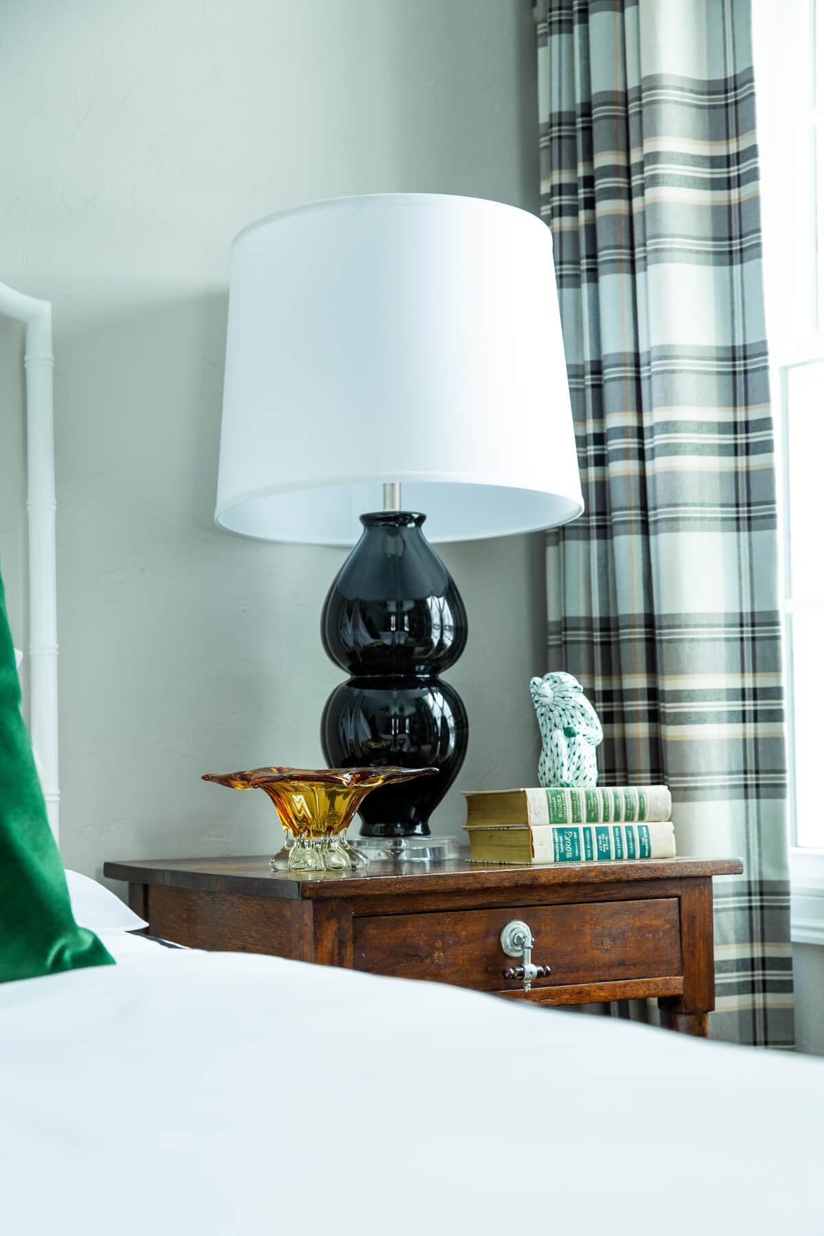 Vintage side tables as nightstands with black lamps for guest bedroom Lindsey Putzier Design Studio