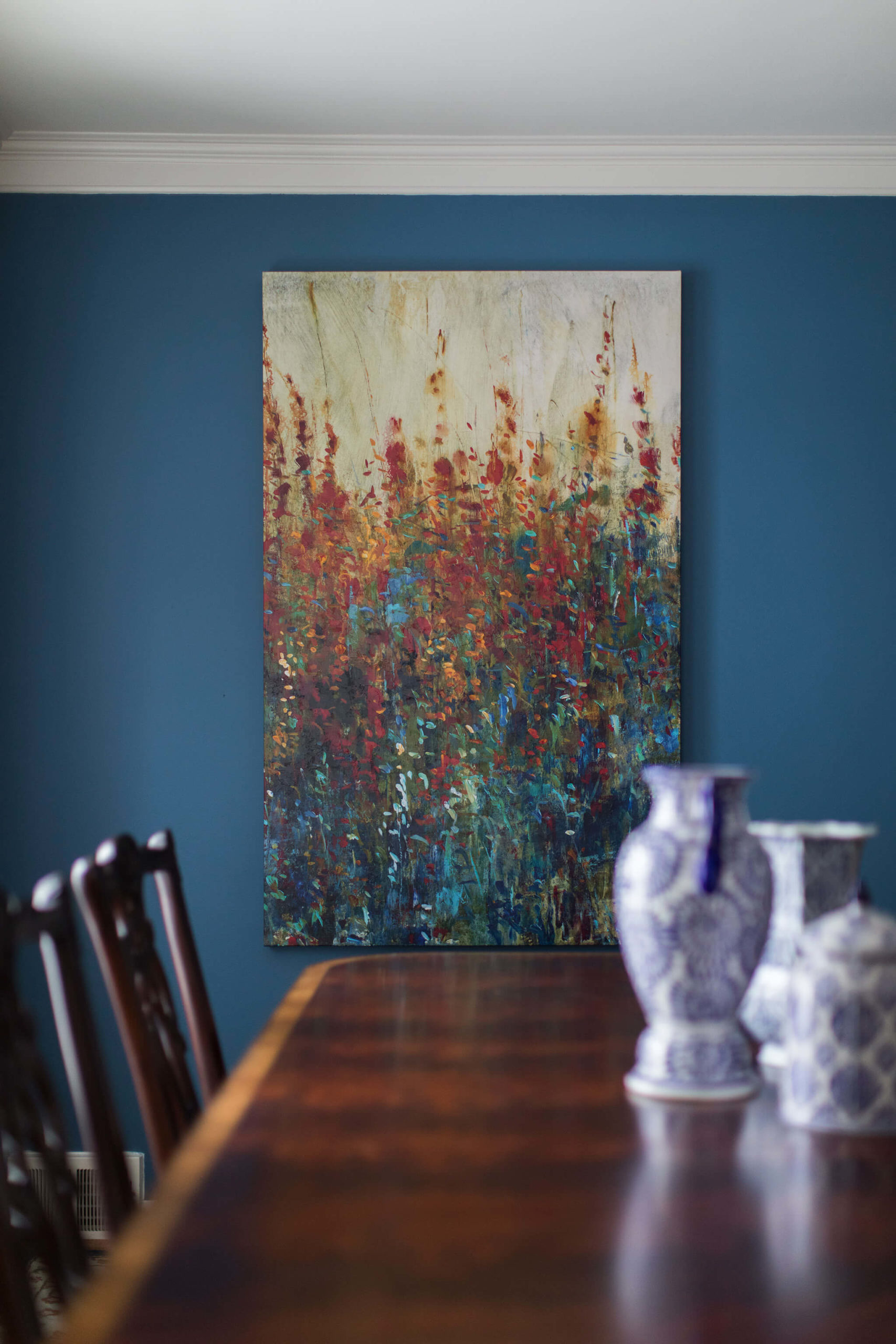 Colorful Dining Room Wall Art warmer tones interspersed with the blues and greens Lindsey Putzier Design Studio