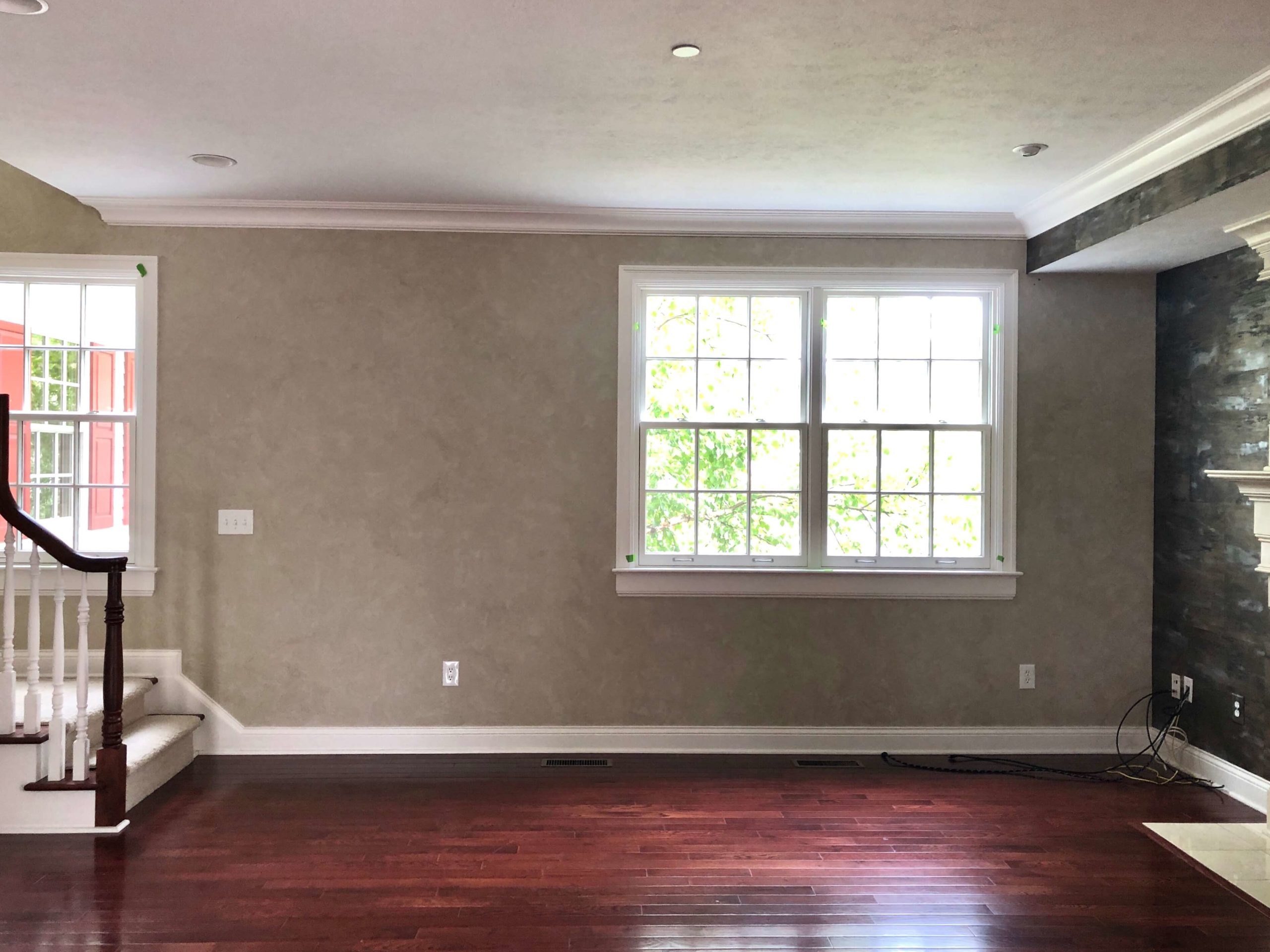 Living Room Walls before in green olive, green beige-y type mixture with a heavy faux paint technique Lindsey Putzier Design Studio