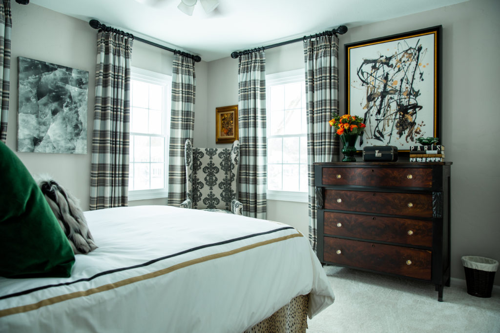 Master Bedroom with vintage dresser and contrasting contemporary artwork Lindsey Putzier Design Studio 