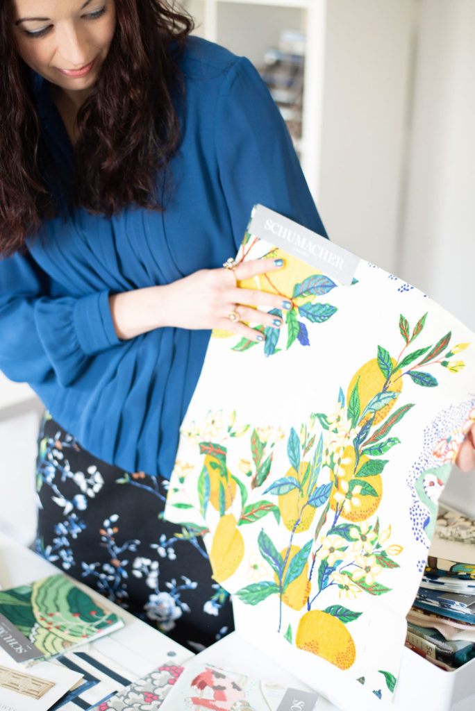 Lindsey Putzier looking through fabric samples Lindsey Putzier Design Studio Ohio