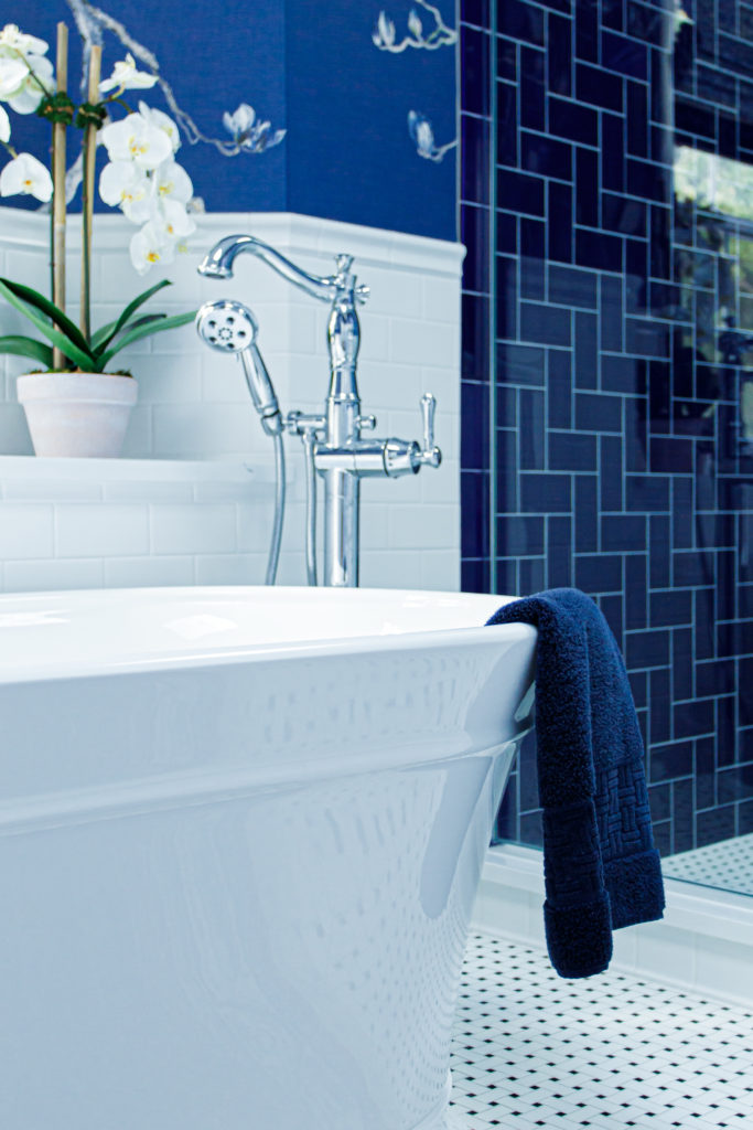 pedestal tub blue herringbone tile Eclectic Interiors