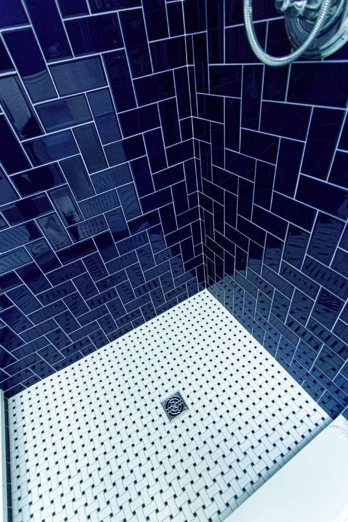 blue herringbone shower basketweave tile Eclectic Interiors