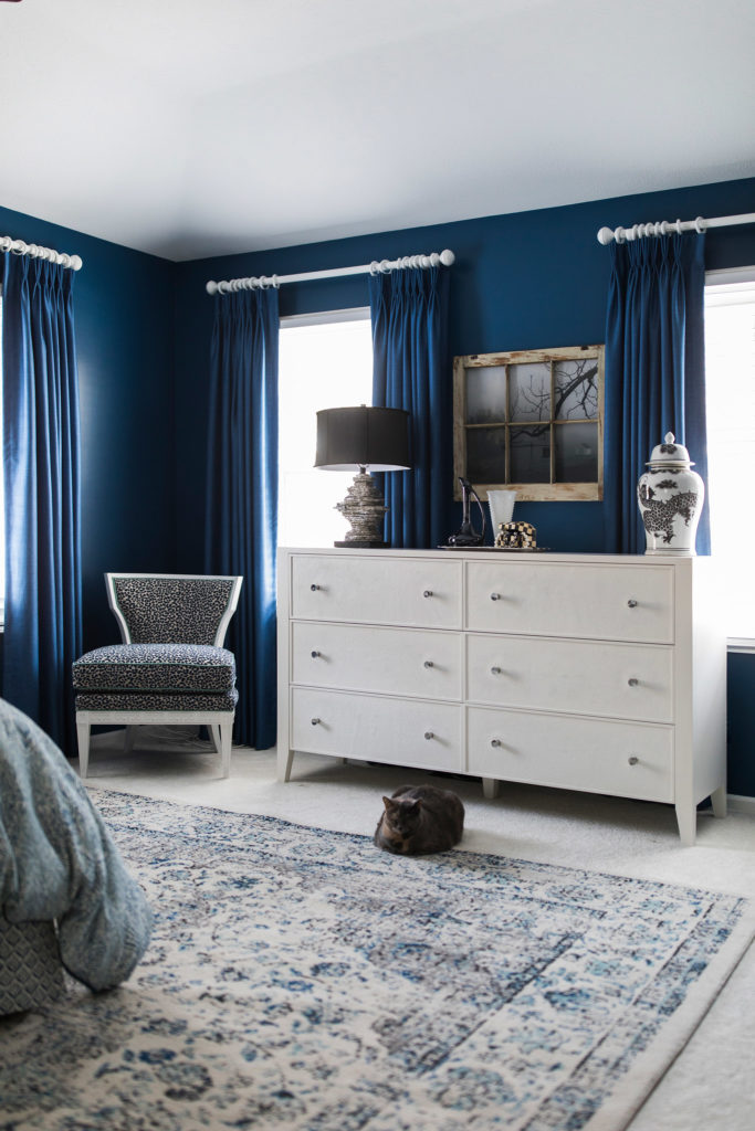 Black and White Furniture in Bedroom with dark blue walls Lindsey Putzier Design Studio