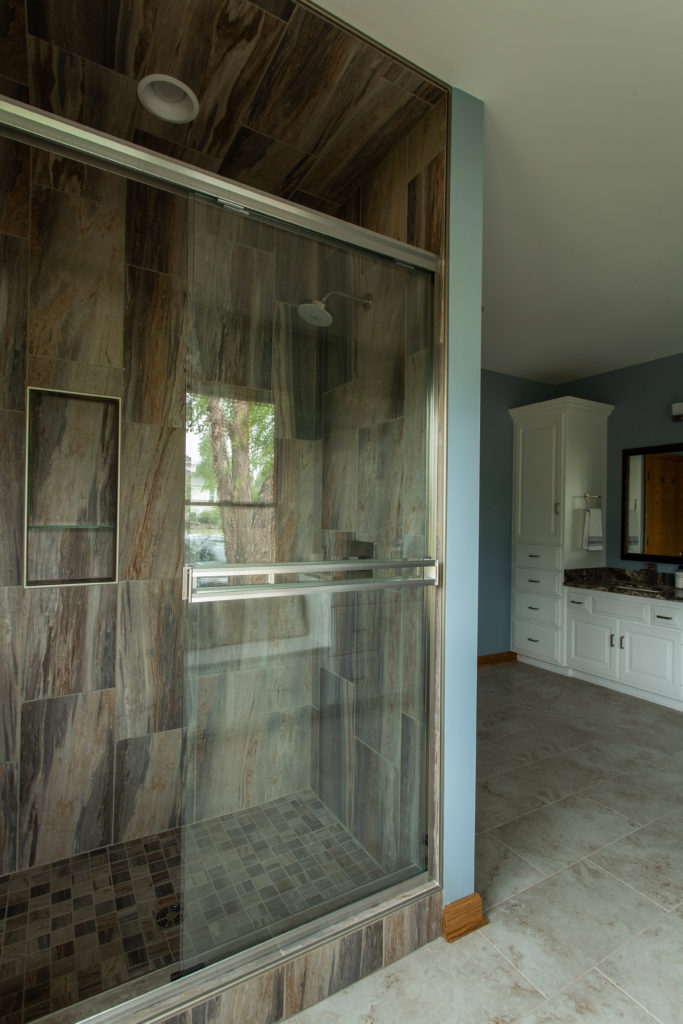 After Photo of Master Bathroom Shower with wood like tile Lindsey Putzier Design Studio Ohio
