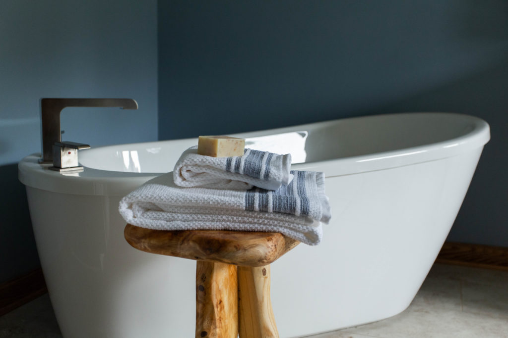 Freestanding tub with streamlined tub faucet Master Bathroom Lindsey Putzier Design Studio