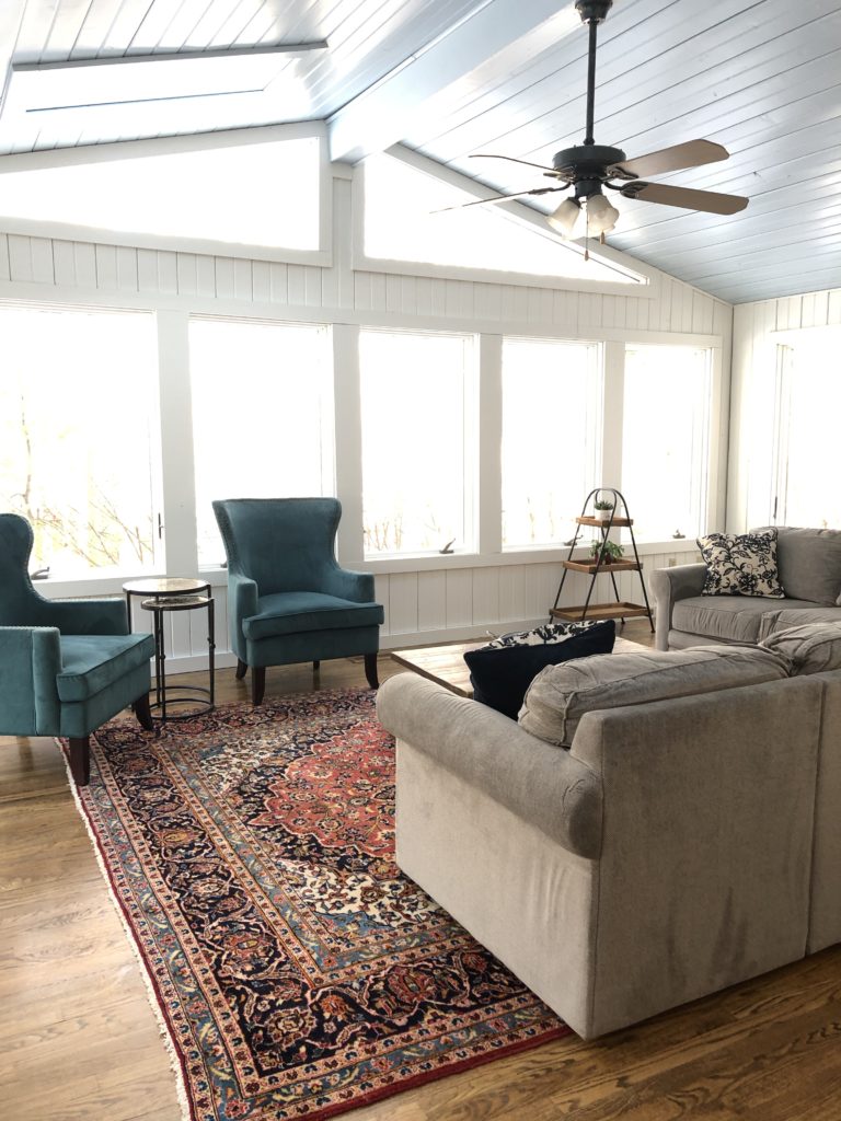 Progress photo of painted walls and ceiling but old ceiling fan in the Sunroom Lindsey Putzier Design Studio