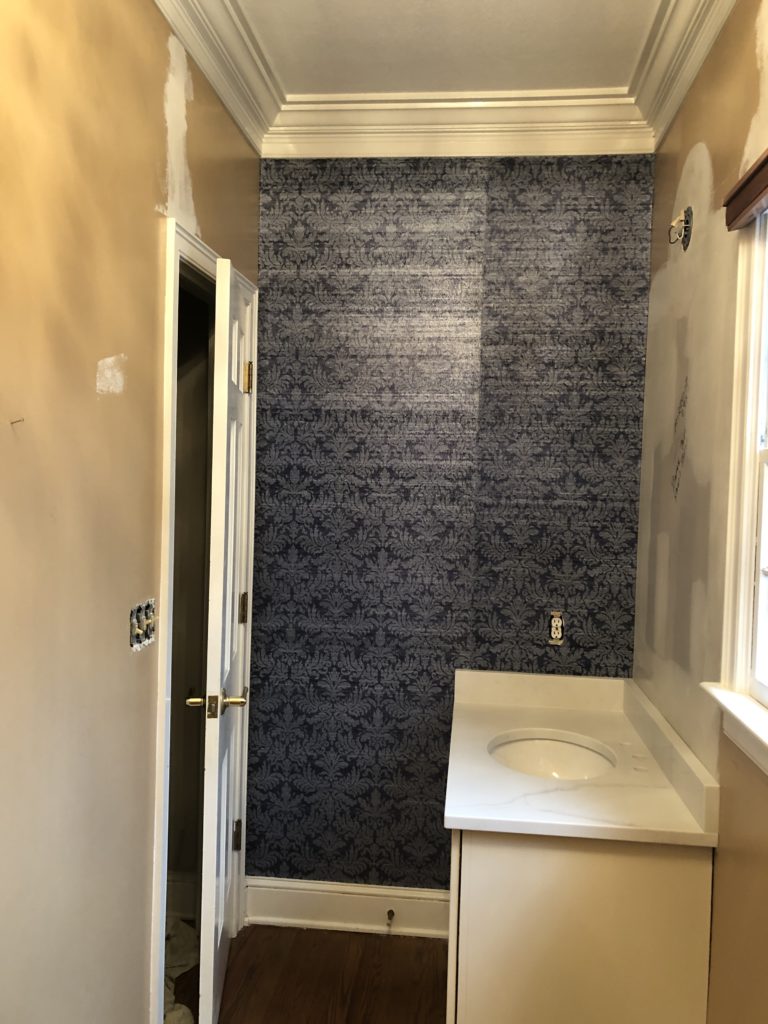 Blue damask wallpaper to replace brown walls of Powder Bathroom Lindsey Putzier Design Studio
