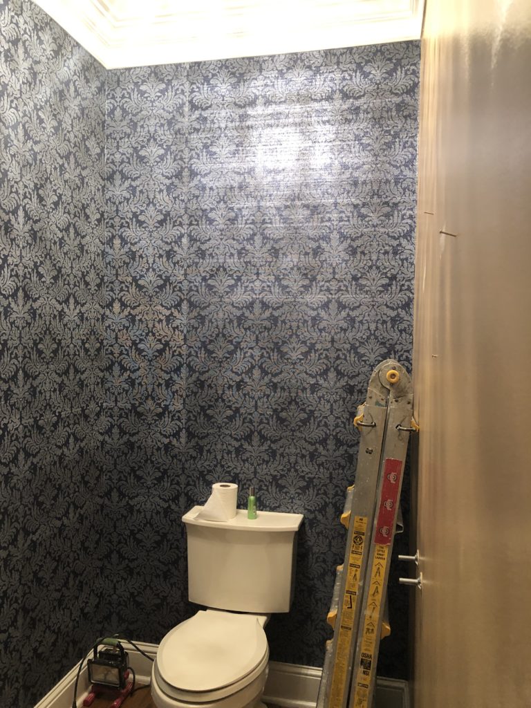 blue damask wallpaper to cover brown walls of half bath Lindsey Putzier Design Studio