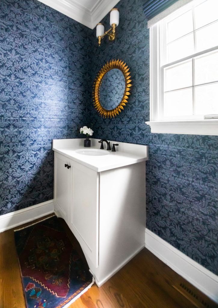 Muli-colored mini rug in front of vanity for Powder Room Lindsey Putzier Design Studio