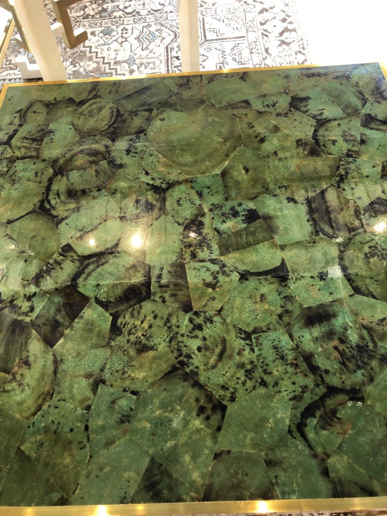 Top of green and black speckled with gold accents statement table Lindsey Putzier Design Studio