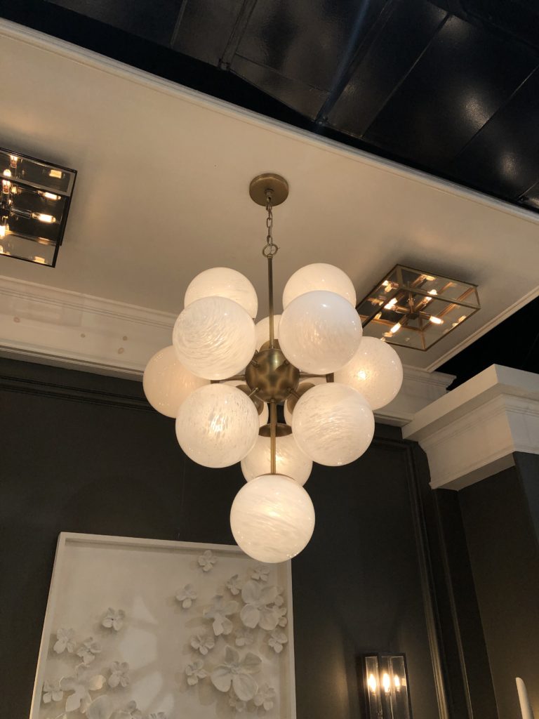 Chandelier made up of textured white orbs Lindsey Putzier Design Studio