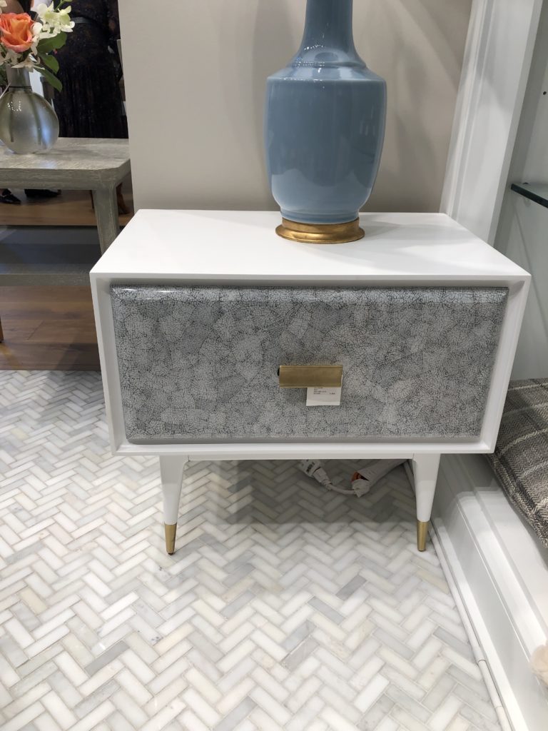 White statement table with gold accents and textured patterned grey drawer Lindsey Putzier Design Studio