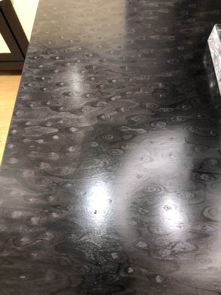 Black statement table with water droplet designs Lindsey Putzier Design Studio