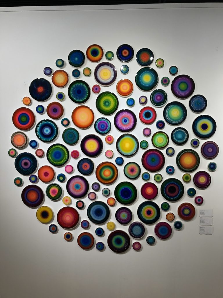 Multi colored geodes making up a circular piece of wall art Lindsey Putzier Design Studio