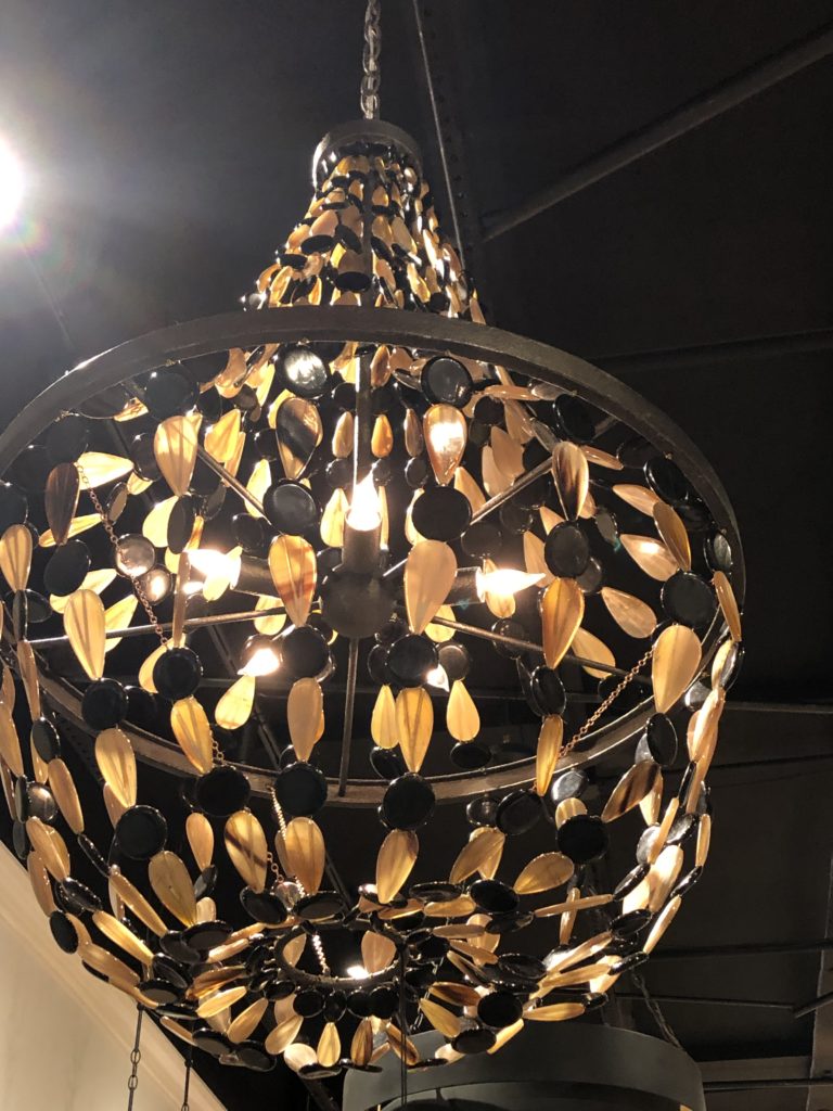 Chandelier with black dots and yellow leaf looking piece strands Lindsey Putzier Design Studio