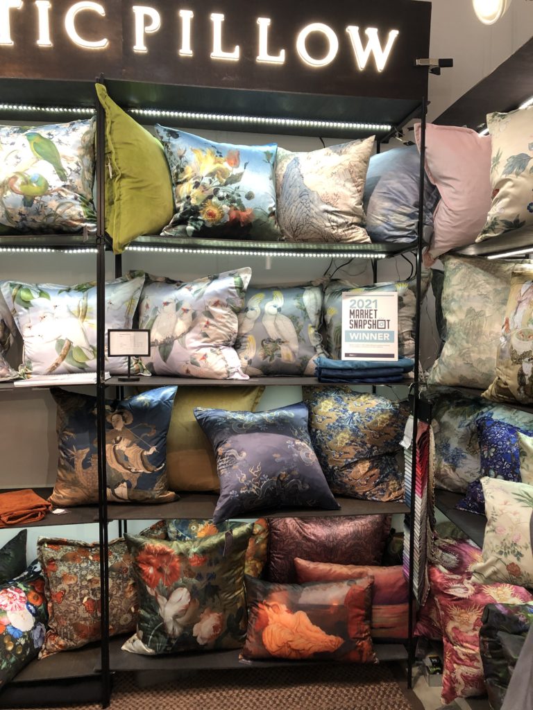 Shelves stuffed with a variety of pillows Lindsey Putzier Design Studio