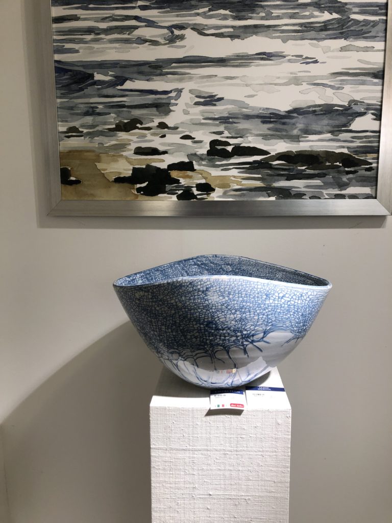 Silver decorative bowl with stringy blue designs amongst the top Lindsey Putzier Design Studio