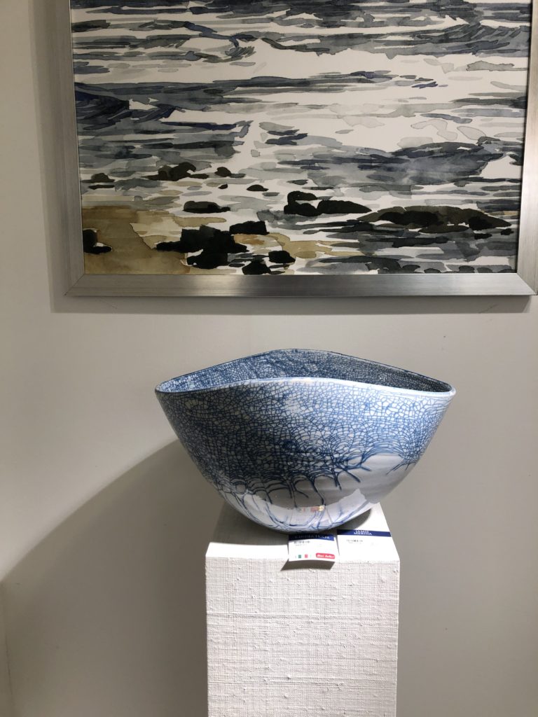Silver decorative bowl with stringy blue designs amongst the top Lindsey Putzier Design Studio