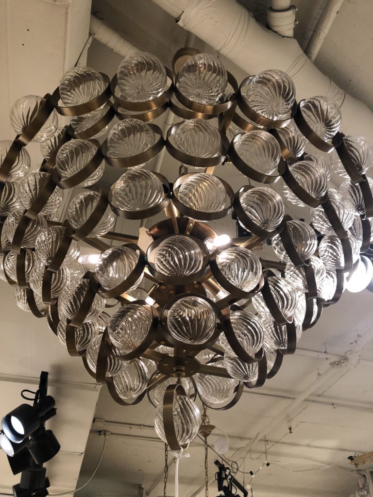 Chandelier covered with clear orbs in bronze circles  Lindsey Putzier Design Studio