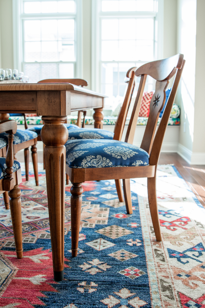 Reupholstered dining chairs with blue cushions Lindsey Putzier Design Studio