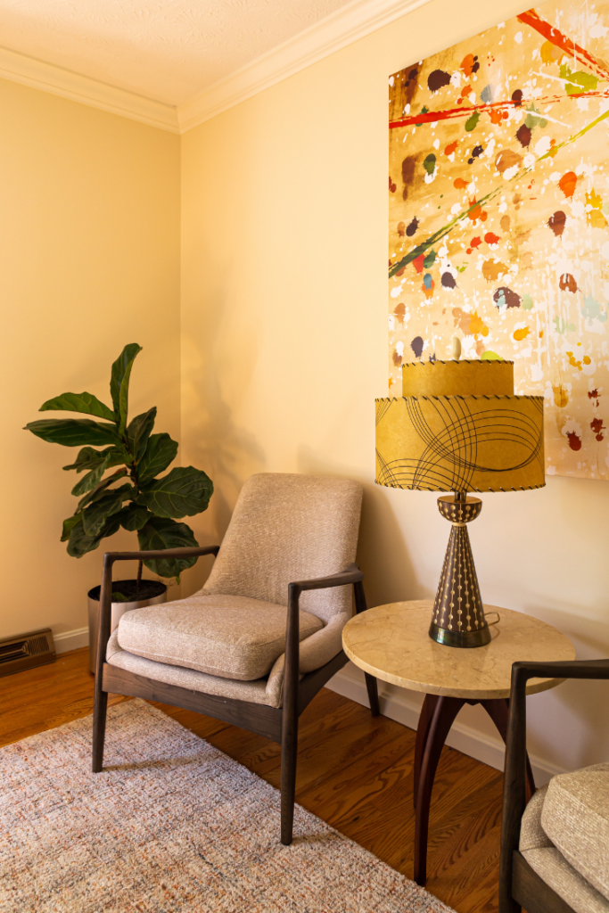 Custom table lamp on top of marble side table Custom drapery panels in Mid-Century Office Lindsey Putzier Design Studio