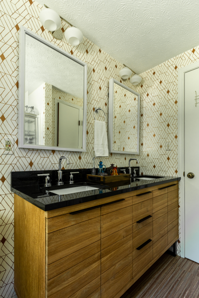 After image of Mid-Century Upstairs guest bathroom with metallic abstract wallpaper Lindsey Putzier Design Studio