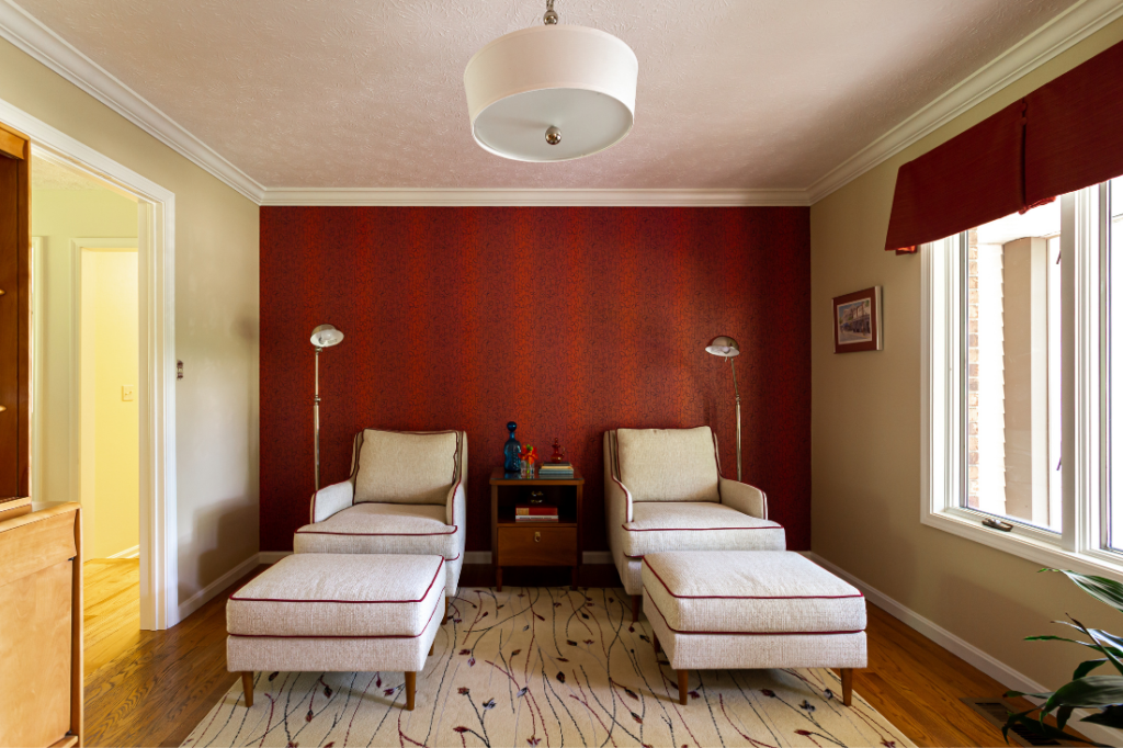 After Image of Mid-Century sitting room with wooden floors and red wallpapered accent wall Lindsey Putzier Design Studio
