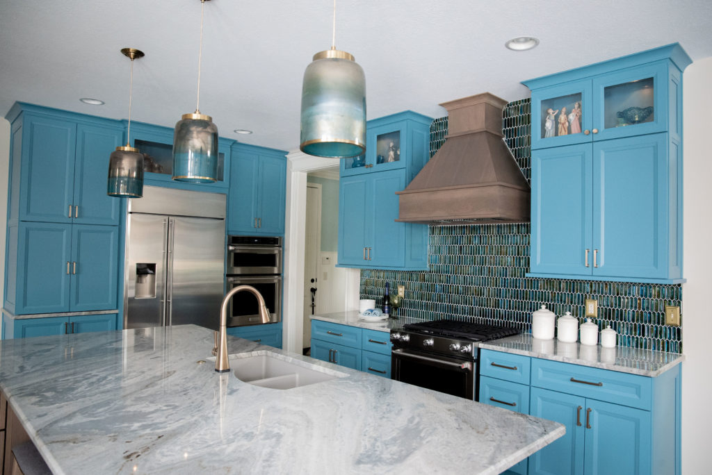 Glass backsplash tile in vibrant Kitchen Design Lindsey Putzier Design Studio