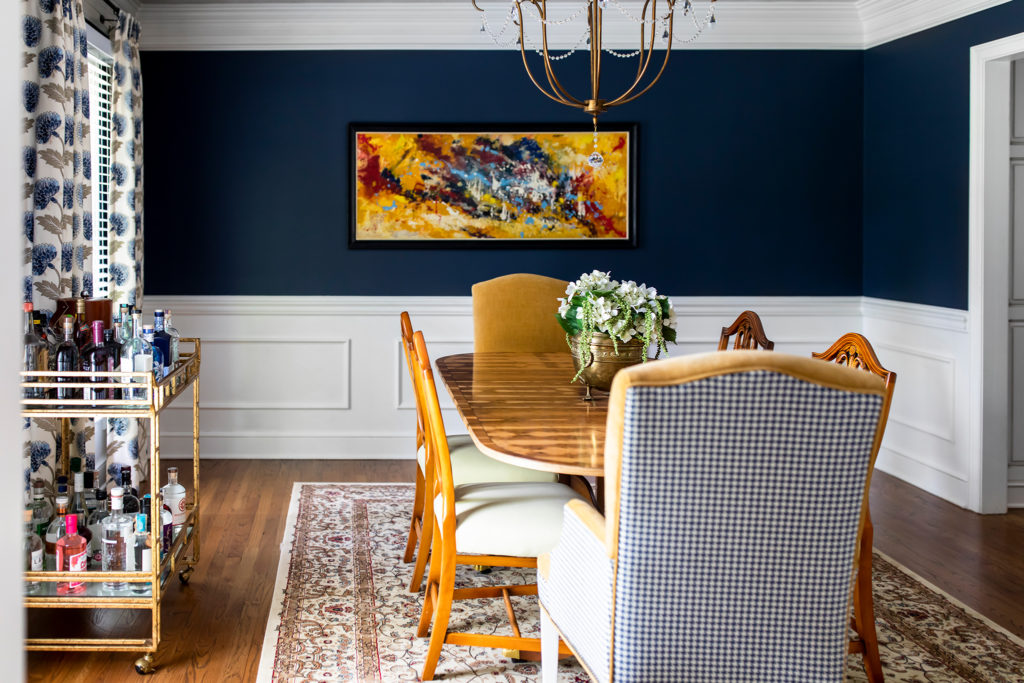 Blue and white dining room with bar cart and custom drapery Lindsey Putzier Design Studio