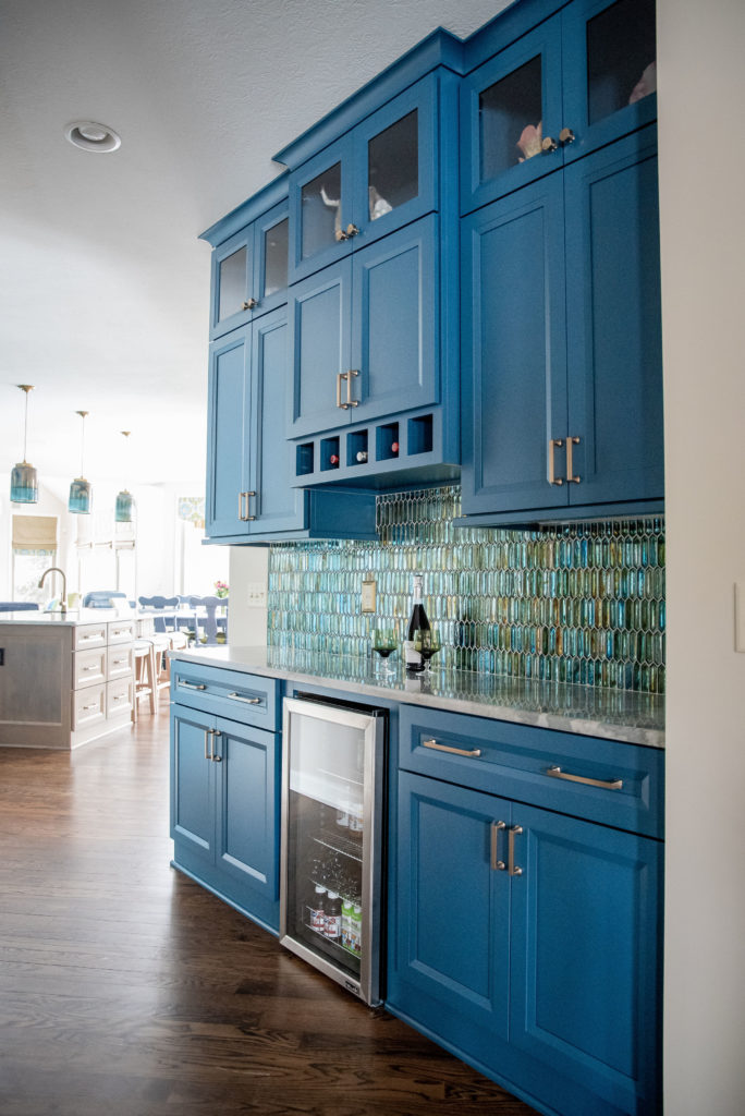 Glass backsplash tile in vibrant Kitchen Design Lindsey Putzier Design Studio