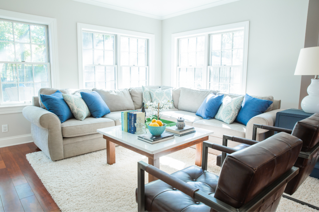 After Image of Living Room with sofa covered in colorful pillows  Lindsey Putzier Design Studio