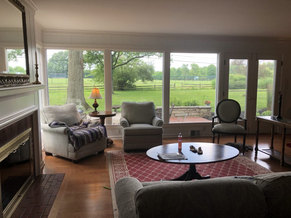 Before Image of Family Room with furniture lined against the walls Lindsey Putzier Design Studio