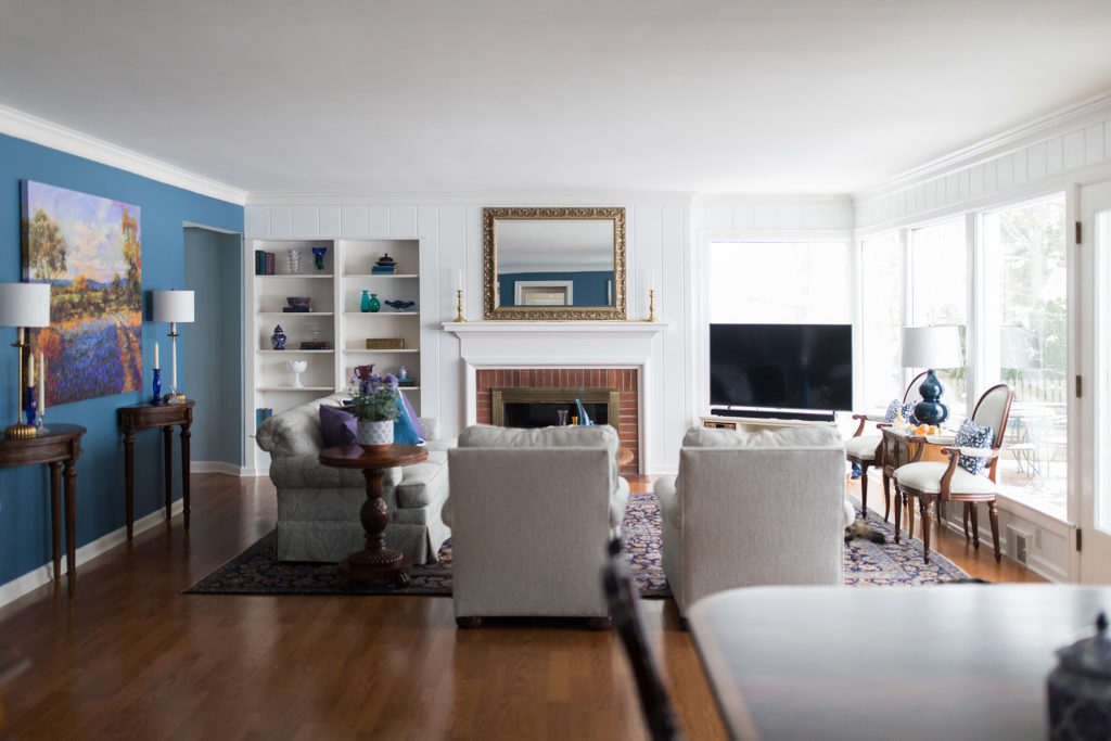 After Image of Family Room with furniture placed strategically throughout the room Before Image of Family Room with furniture lined against the walls Lindsey Putzier Design Studio