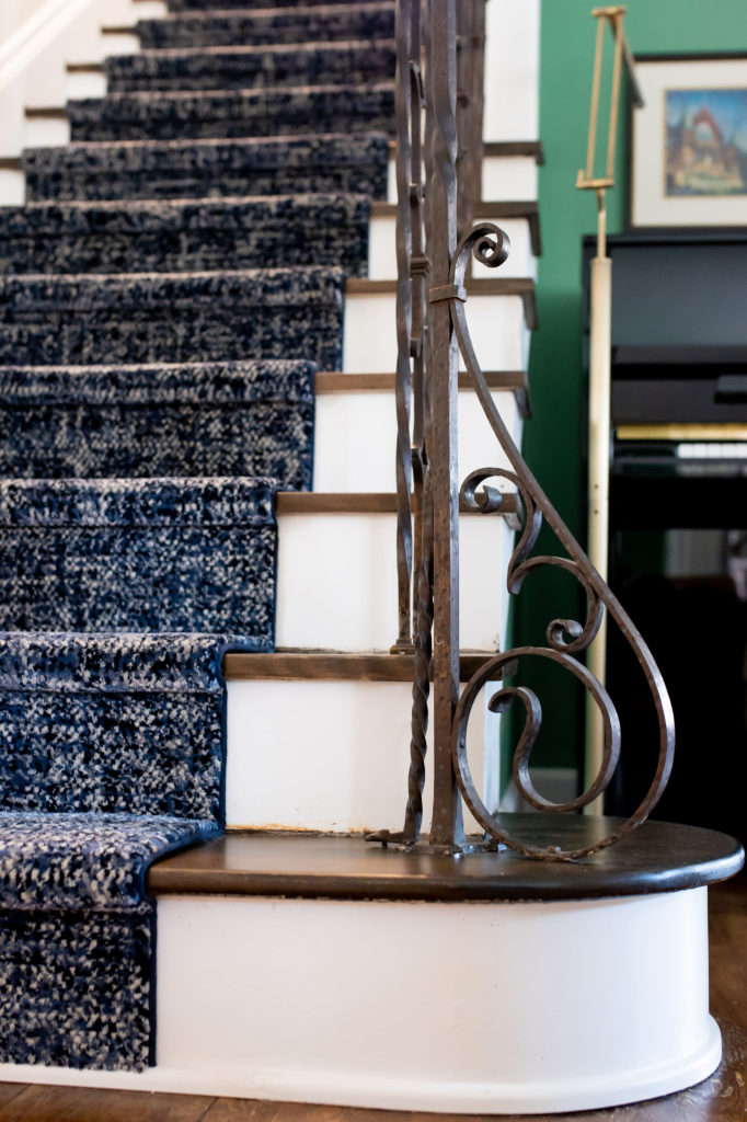 Blue and white stairway runner with dark stained wooden treads Lindsey Putzier Design Studio